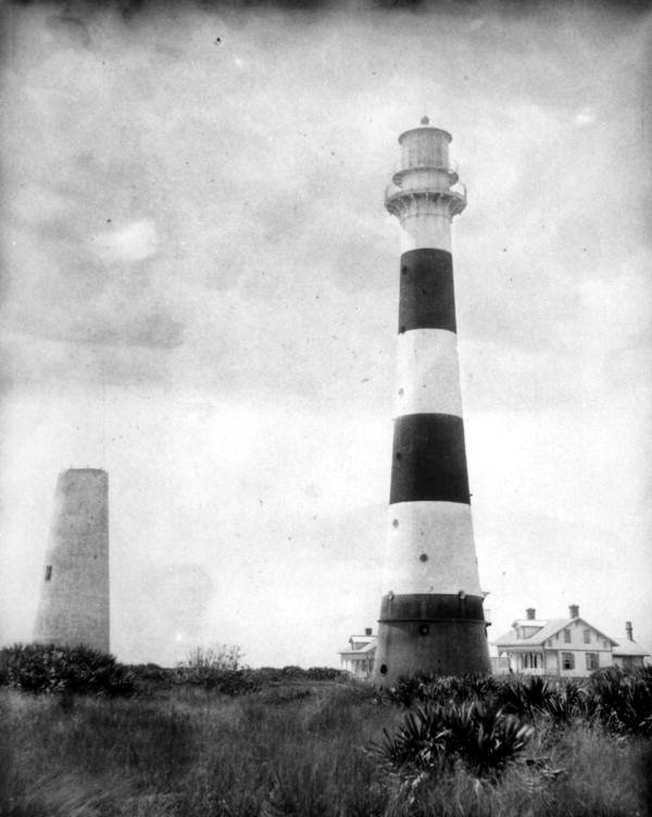 The Cape Canaveral Lighthouse photographed around 1890, both the 1848 brick tower and the 1868 iron replacement visible.